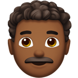 Apple design of the man: medium-dark skin tone curly hair emoji verson:ios 16.4