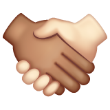 Whatsapp design of the handshake: medium skin tone light skin tone emoji verson:2.23.2.72