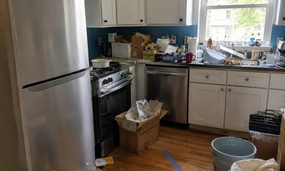 Realistic editorial photo of an American small kitchen showing skipping a real declutter before remodeling