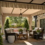 Realistic editorial photo of an outdoor patio with pergola curtains, seating, plants, fabric panels, and sunlight showing short valances making ceilings look lo